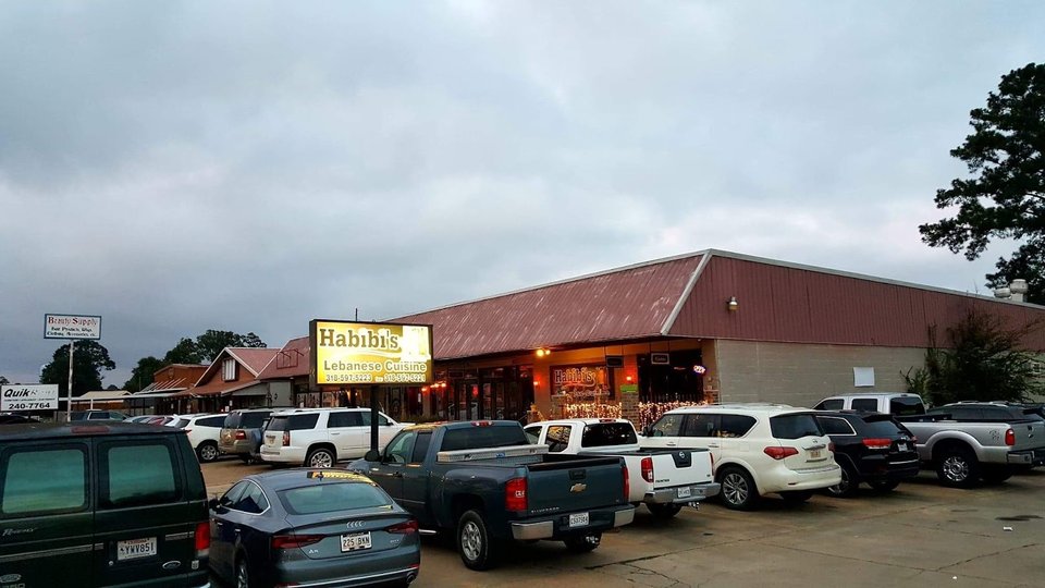 Restaurant exterior with Arabic-inspired signage.